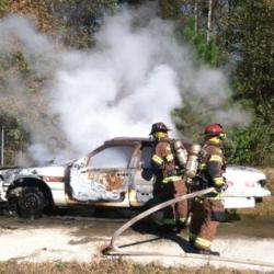 firefighters and smoking car