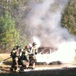 firefighters and smoking car