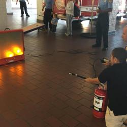 child using extinguish simulator 