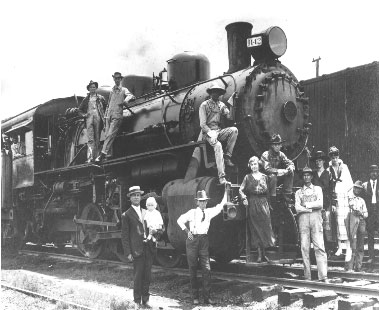 old photo of people by train